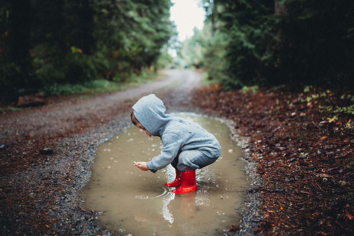 Children Playing in Rain Puddle